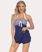 Navy halter tankini swimsuit with white striped cups and bow-front tie