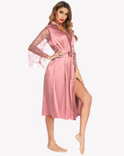 Blush satin kimono robe with lace sleeves, V-neck, tie belt, side slit.