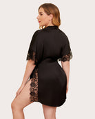 Black satin sleep robe back view with lace-trimmed sleeves and tied waist belt.