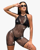Black fishnet halter bodysuit romper with cutout mesh panels and short legs.