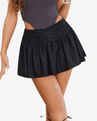 Black glitter ruffle mini skirt, gathered waist and pleated flare hem