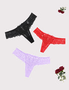 Lace thong with scalloped trim and cross-back design; black, red, light purple.