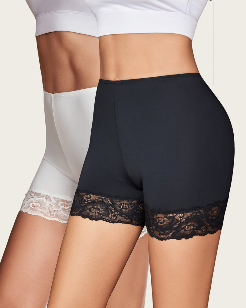 White and black shapewear shorts with lace hem and smooth compression coverage.