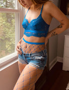 Blue fishnet stockings with high-waist waistband and diamond grid pattern