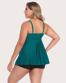 Teal tankini top with strappy back and matching black swim shorts