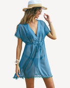 Blue swimsuit cover-up dress with tie waist and tassel trim hem