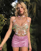 Embroidered butterfly crop top with pink sequin mini skirt and pearl chain, butterfly appliques