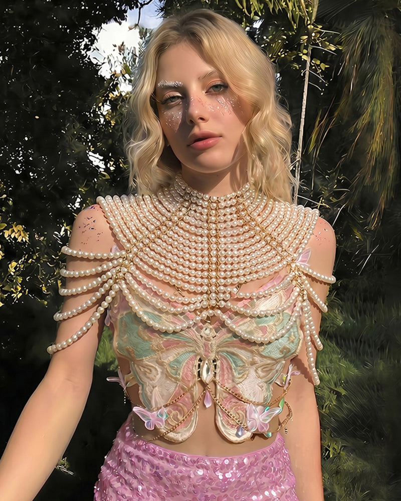 Embroidered butterfly top with pearl shoulder chain and pink sequin mini skirt