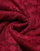 Wine red lace fabric texture close-up with scalloped floral pattern