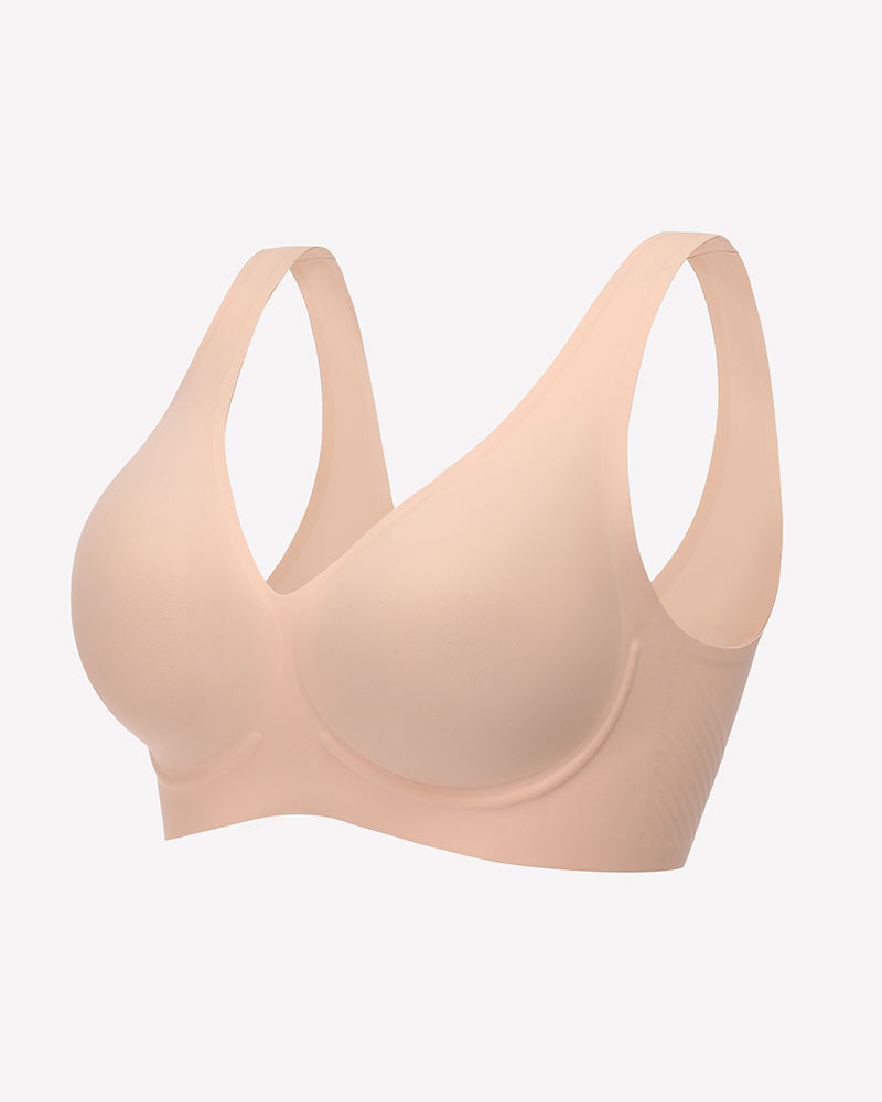 Light pink seamless V-neck bralette with full-coverage cups and smooth, seam-free finish.