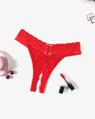 Red lace t-back thong with scalloped edges, laid flat