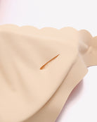 Wireless V-neck seamless full-coverage bra, nude, smooth seamless fabric close-up