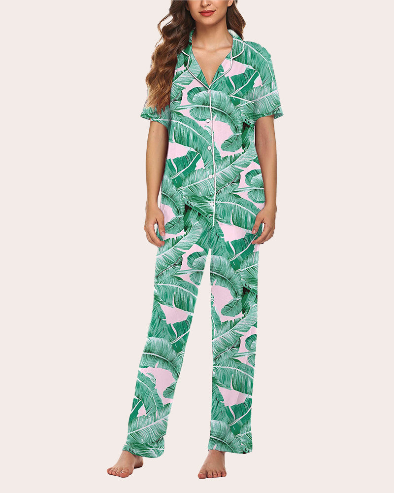 Green tropical leaf pajama set with short-sleeve top and long pants, pink accents