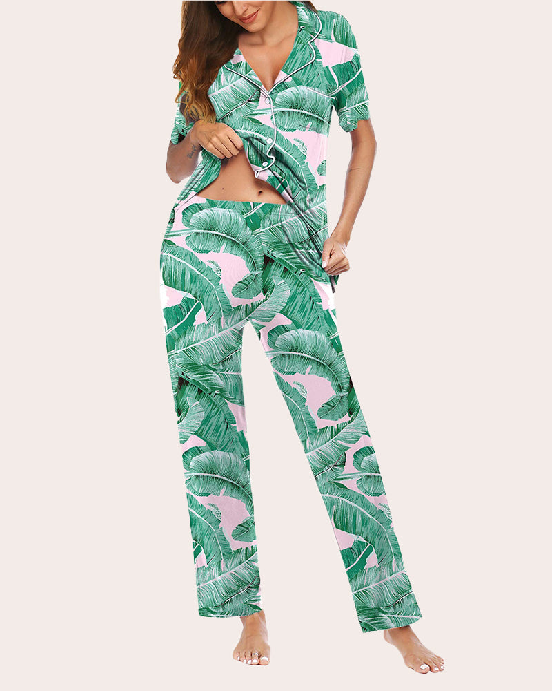 Green tropical leaf pajama set with short-sleeve top and long pants, pink flower print