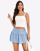 Light blue mini glitter ruffle skirt with gathered waist and flared hem