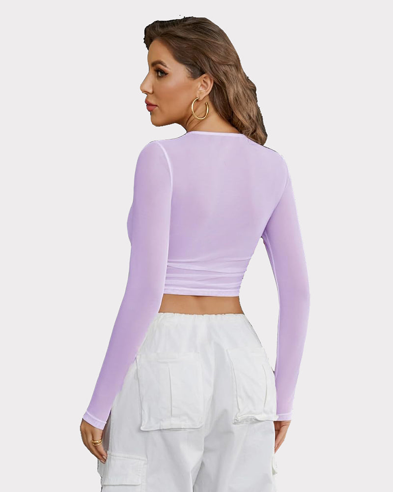 Sheer mesh long sleeve crop top in lilac, back view with ruched waistband