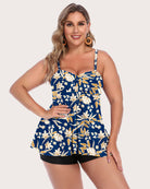 Two-piece tankini set with blue floral tankini top and black swim shorts