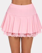 Pink pleated mini ruffle skirt with lace hem and gathered waist