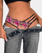 Mesh thong with black side straps and pink floral embroidery along the waistband