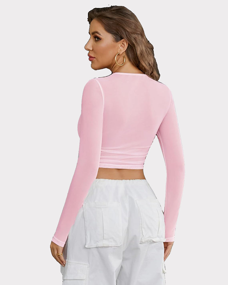 Pink sheer mesh long sleeve crop top, back view with crew neck