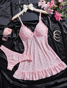 Pink sheer chiffon babydoll with black dots, bow detail, ruffle hem, and matching G-string