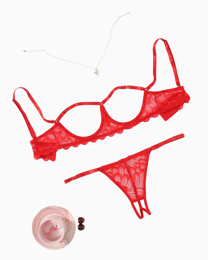 Red cupless bra and panty set laid out: lace balconette bra and thong briefs