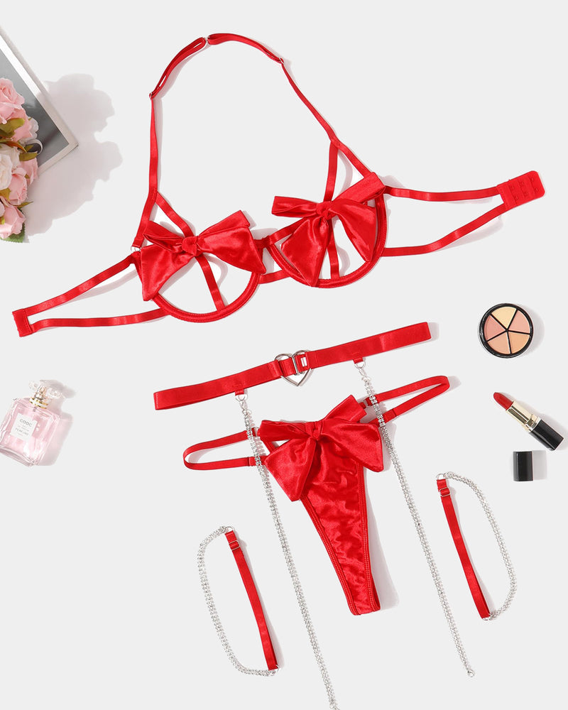Red bow bra and thong panty set with satin bows, heart choker, and chain garters
