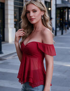 Red sheer mesh top with off-shoulder flutter sleeves and a layered hem