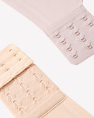 Light nude push-up wireless bra back band with hook-and-eye closures, close-up.