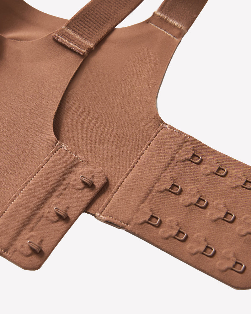 Coffee push-up wireless bra back band with multiple hook-and-eye closures, close-up.
