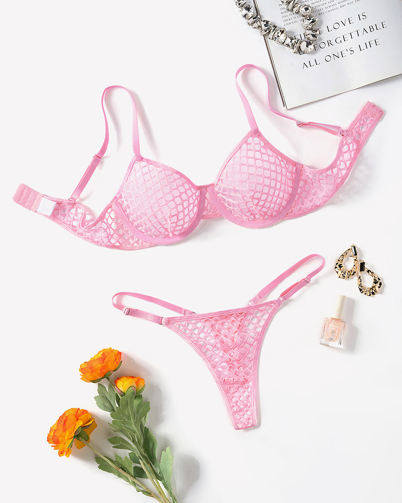 Pink fishnet hollow-out push-up bra and thong set laid flat