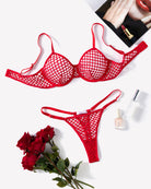 Red fishnet hollow-out push-up bra and thong set, flat lay