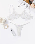 White fishnet push-up bra and sheer thong set, underwire-style hollow cups