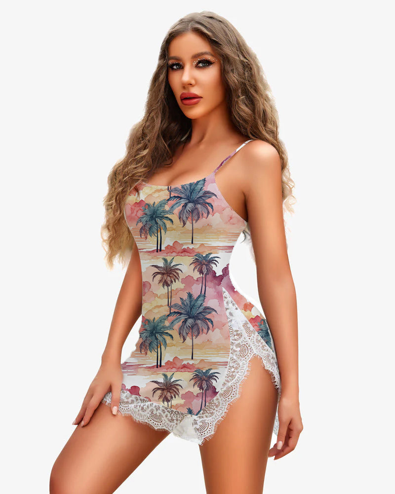Pink palm-print slip dress with lace trim, spaghetti straps, and side slit