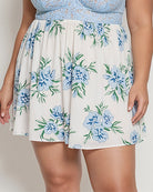 Floral babydoll skirt with gathered empire waist and blue flower pattern