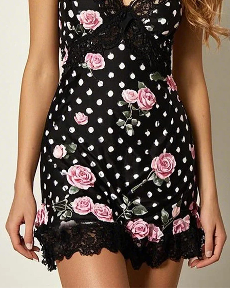Black lace sleep dress with scalloped hem and pink rose print over white polka dots.