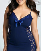 Navy lace patchwork mini dress with scalloped neckline, spaghetti straps, and blue bow