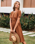 Caramel open-back midi dress with short sleeves and front patch pocket details