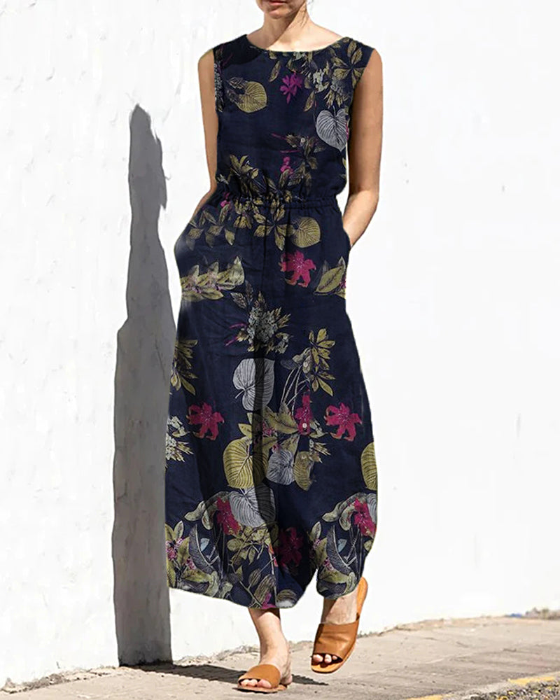 Navy floral leaf print sleeveless wide-leg long jumpsuit with elastic waist and crew neck