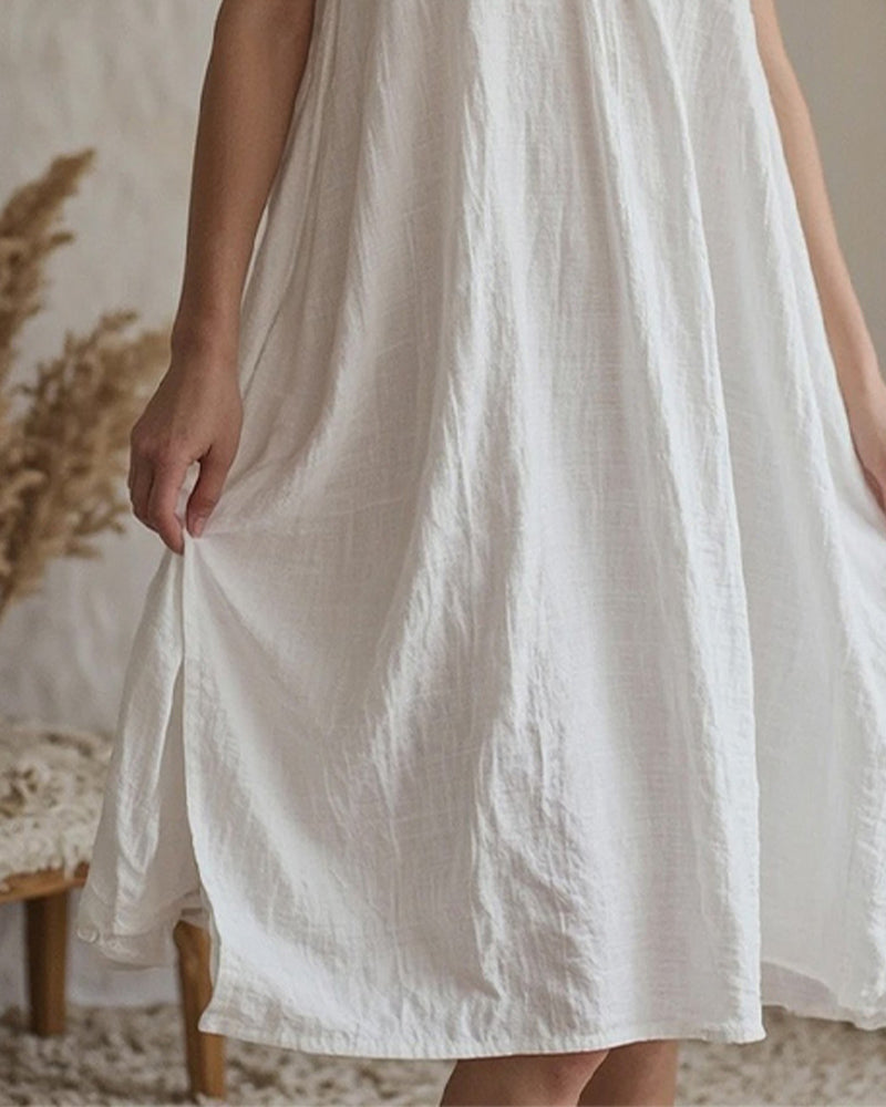 White nightdress hem with slight side slit and gathered A-line skirt