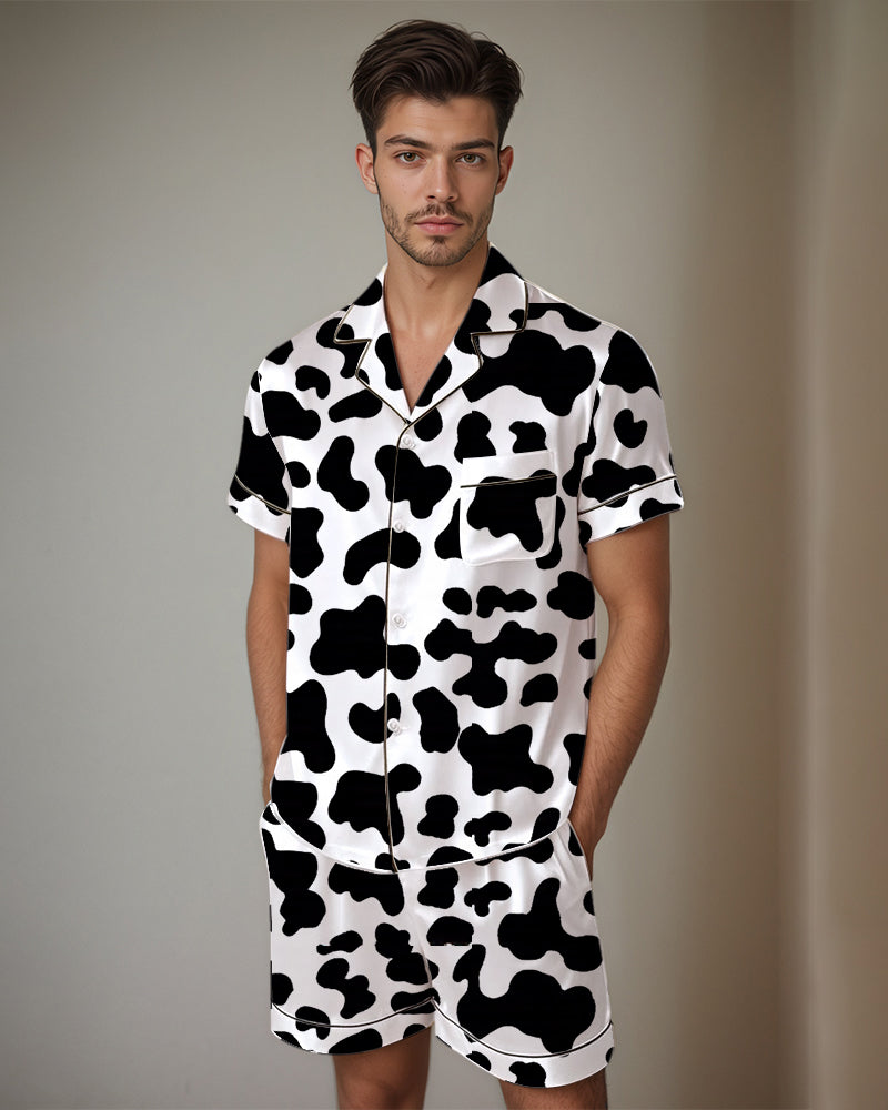 Satin pajama set with cow-print short-sleeve button-up shirt and matching shorts