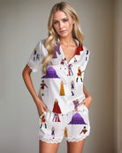 Women’s satin pajama set with white button-up shirt, music-themed characters, lace trim shorts