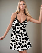 Women’s satin suspender pajama chemise with cow print and black lace trim neckline