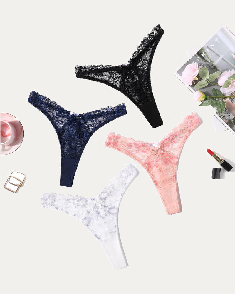 Four lace g-string thongs: black, navy, pink, white