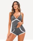 Grey cami and short pajama set with white lace trim and thin spaghetti straps