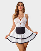 White and black maid babydoll dress with crisscross lace bodice and striped ruffle hem