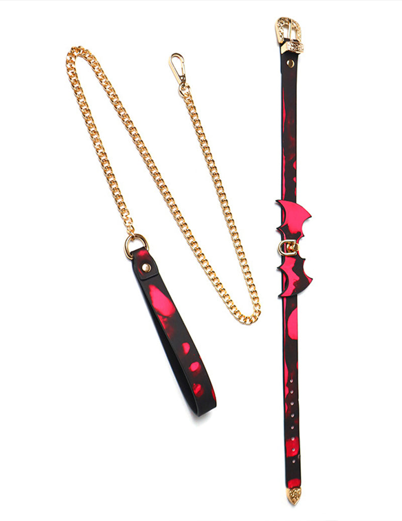 Red bat-wing choker and matching leash with gold chain links