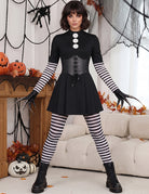 Black gothic mini dress with corset front, striped leggings, and long striped sleeves