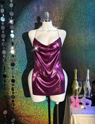 Purple holographic metallic bodycon mini dress on mannequin, cowl neck and chain straps