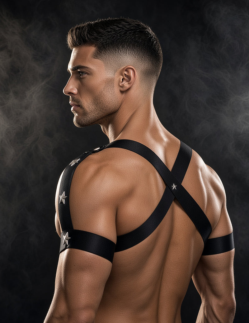 Men's black star harness thong set with back straps and round ring, profile view